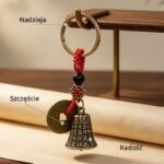 Dzwoneczek feng shui z monetą zawieszony na stojaku